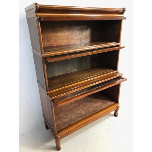 306 - Three section Globe Wernicke bookcase with two leaded glazed panel doors, the lower stepped case wit... 