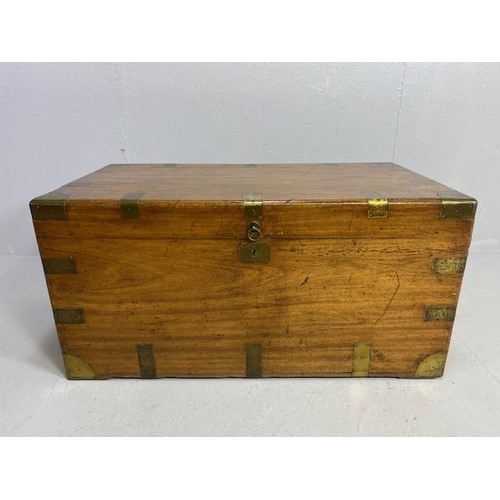 313 - Large Campaign travelling trunk with brass bindings and corners and hinged carry handles to sides ap... 