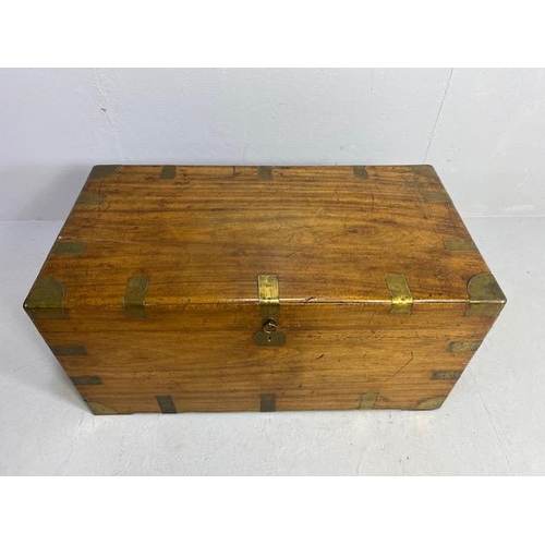 313 - Large Campaign travelling trunk with brass bindings and corners and hinged carry handles to sides ap... 