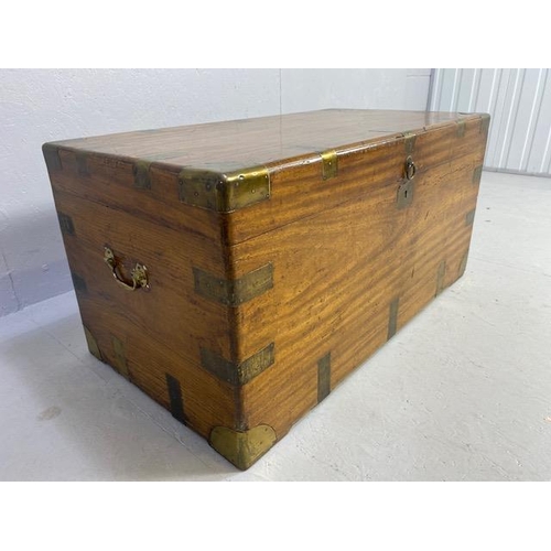 313 - Large Campaign travelling trunk with brass bindings and corners and hinged carry handles to sides ap... 