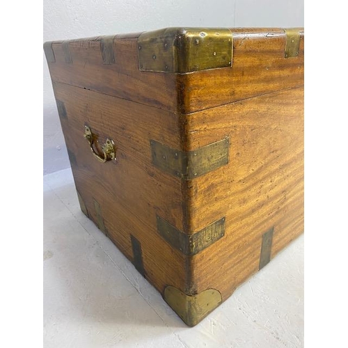 313 - Large Campaign travelling trunk with brass bindings and corners and hinged carry handles to sides ap... 