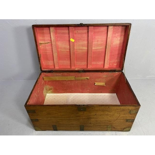 313 - Large Campaign travelling trunk with brass bindings and corners and hinged carry handles to sides ap... 