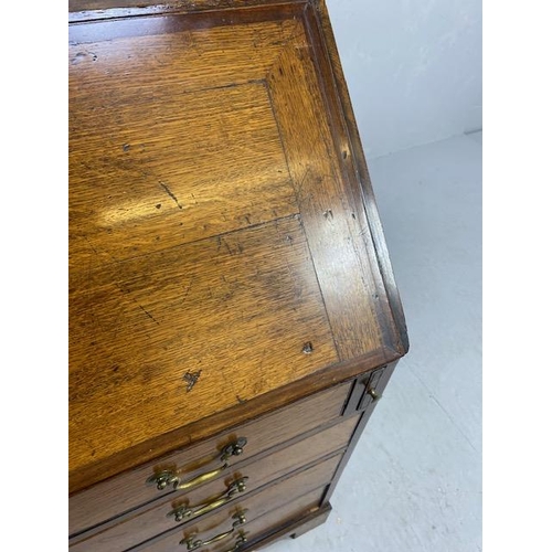 316 - Oak Bureau with four drawers, fall front revealing pigeon holes and ornate key to lock