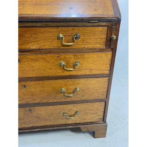 316 - Oak Bureau with four drawers, fall front revealing pigeon holes and ornate key to lock