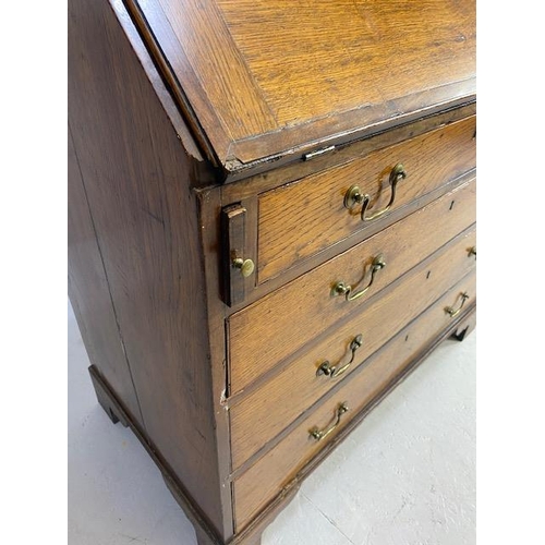 316 - Oak Bureau with four drawers, fall front revealing pigeon holes and ornate key to lock