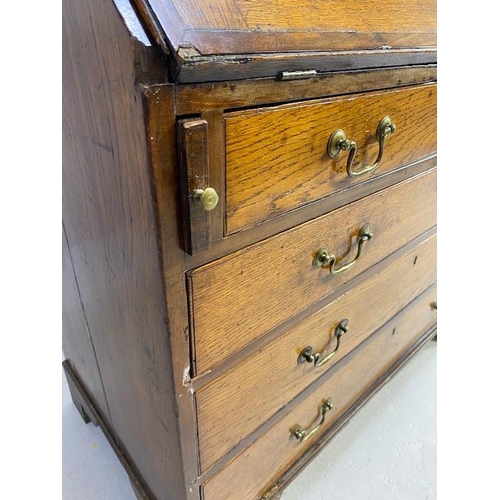 316 - Oak Bureau with four drawers, fall front revealing pigeon holes and ornate key to lock