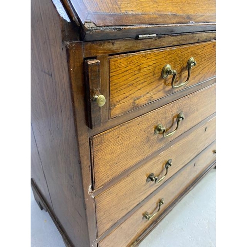 316 - Oak Bureau with four drawers, fall front revealing pigeon holes and ornate key to lock