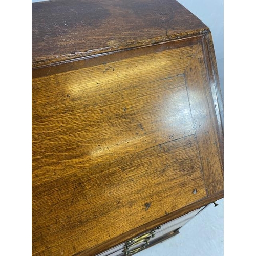 316 - Oak Bureau with four drawers, fall front revealing pigeon holes and ornate key to lock