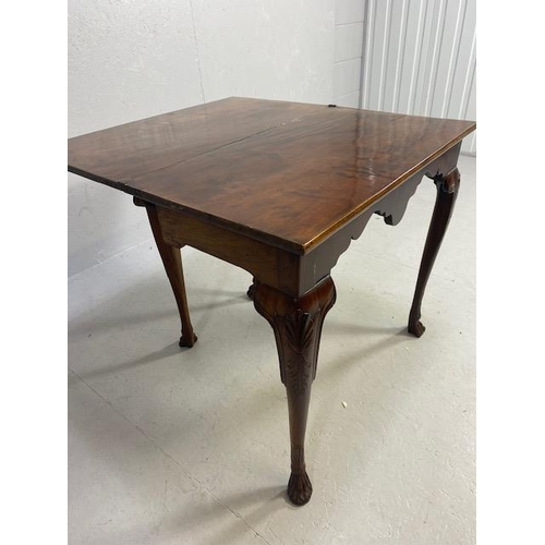 317 - Victorian side table with folding leaf extending to make a tea table in flame mahogany with lion paw... 