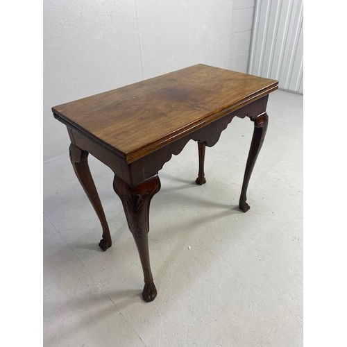 317 - Victorian side table with folding leaf extending to make a tea table in flame mahogany with lion paw... 