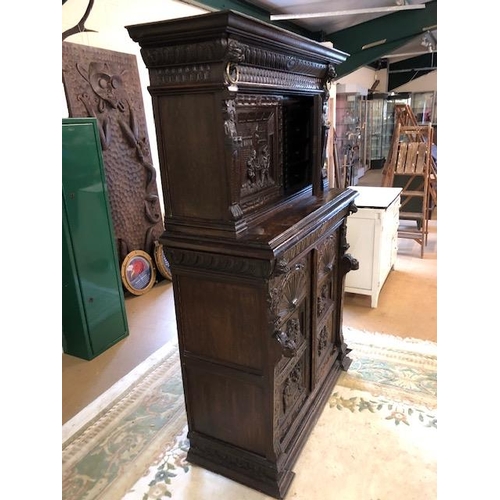 318 - Dresser: late 19th century dark oak continental buffet cupboard, having extensive pictorial carved d... 