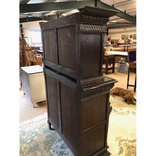 318 - Dresser: late 19th century dark oak continental buffet cupboard, having extensive pictorial carved d... 