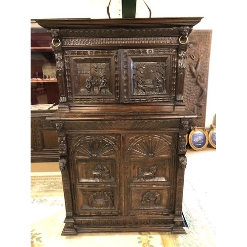 318 - Dresser: late 19th century dark oak continental buffet cupboard, having extensive pictorial carved d... 