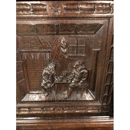 318 - Dresser: late 19th century dark oak continental buffet cupboard, having extensive pictorial carved d... 