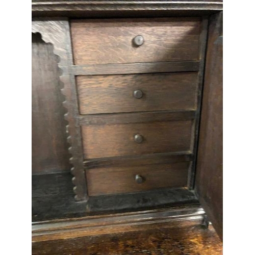 318 - Dresser: late 19th century dark oak continental buffet cupboard, having extensive pictorial carved d... 