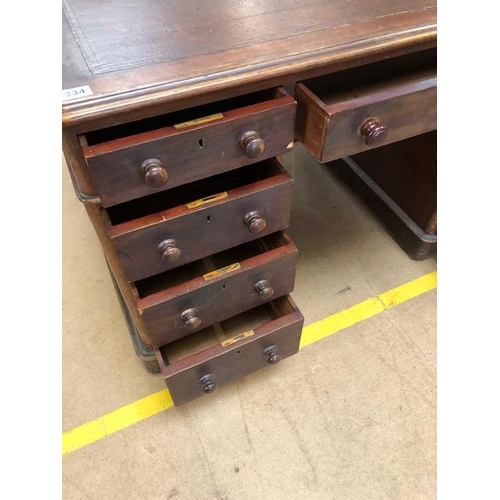 334 - Twin pedestal leather topped writing desk with total nine drawers with turned handles