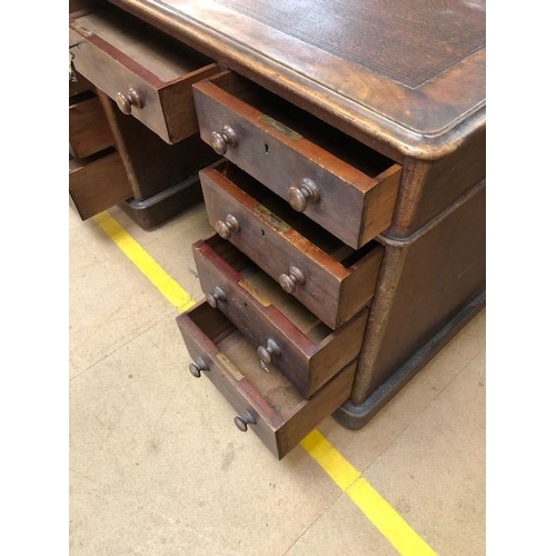 334 - Twin pedestal leather topped writing desk with total nine drawers with turned handles