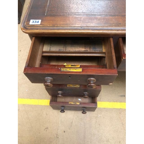 334 - Twin pedestal leather topped writing desk with total nine drawers with turned handles