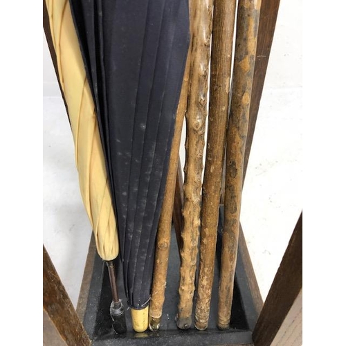 342 - Collection of Vintage walking sticks and umbrellas in a square oak stand with drip tray