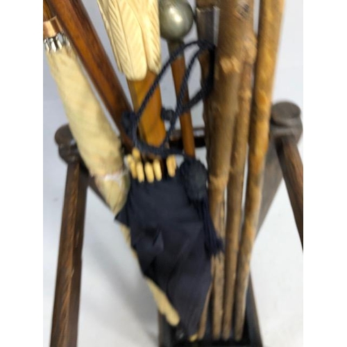 342 - Collection of Vintage walking sticks and umbrellas in a square oak stand with drip tray