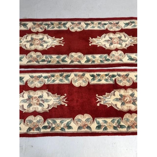 352 - Chinese wool rugs, two sculpted hall runners with typical designs of flowers against red back ground... 