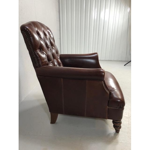 355 - Burgundy leather button back fireside chair with stud detailing and turned front legs