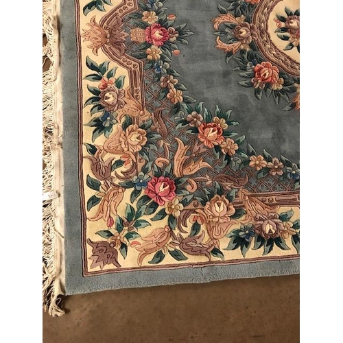 358 - Chinese wool rug of sculpted style with typical designs of flowers and trellis  against a blue grey ... 