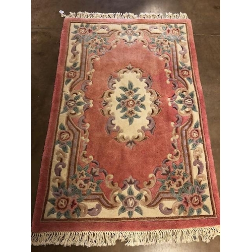 360 - Chinese wool rug of sculpted style with typical designs of flowers   against a  classic Pink  back g... 