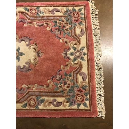 360 - Chinese wool rug of sculpted style with typical designs of flowers   against a  classic Pink  back g... 