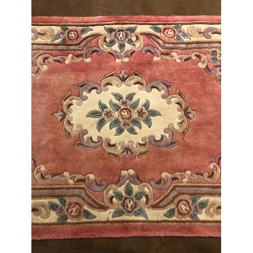 360 - Chinese wool rug of sculpted style with typical designs of flowers   against a  classic Pink  back g... 