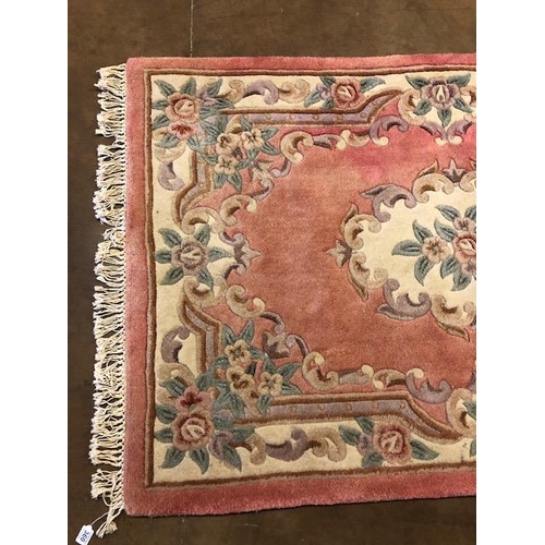 360 - Chinese wool rug of sculpted style with typical designs of flowers   against a  classic Pink  back g... 