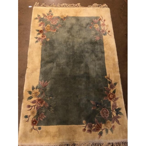 361 - Chinese wool rug of sculpted style with typical designs of flowers against a blue grey back ground a... 