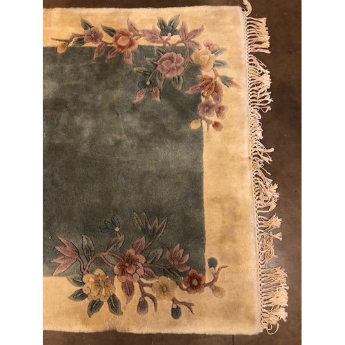 361 - Chinese wool rug of sculpted style with typical designs of flowers against a blue grey back ground a... 