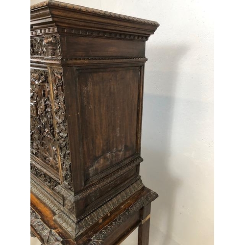 366 - Heavily carved square cupboard on stand, carved with inscription 