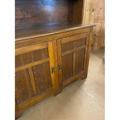 367 - Arts and Crafts oak dresser with shelves above and two cupboards under by maker Curtiss & Sons, appr... 