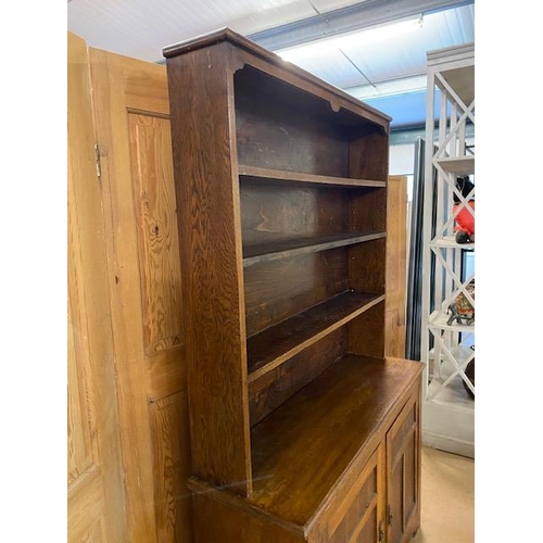 367 - Arts and Crafts oak dresser with shelves above and two cupboards under by maker Curtiss & Sons, appr... 