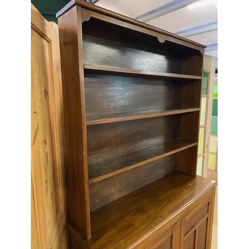 368 - Arts and Crafts oak dresser with shelves above and two cupboards under by maker Curtiss & Sons, appr... 