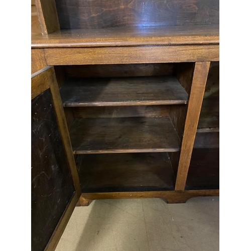 368 - Arts and Crafts oak dresser with shelves above and two cupboards under by maker Curtiss & Sons, appr... 