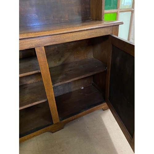 368 - Arts and Crafts oak dresser with shelves above and two cupboards under by maker Curtiss & Sons, appr... 