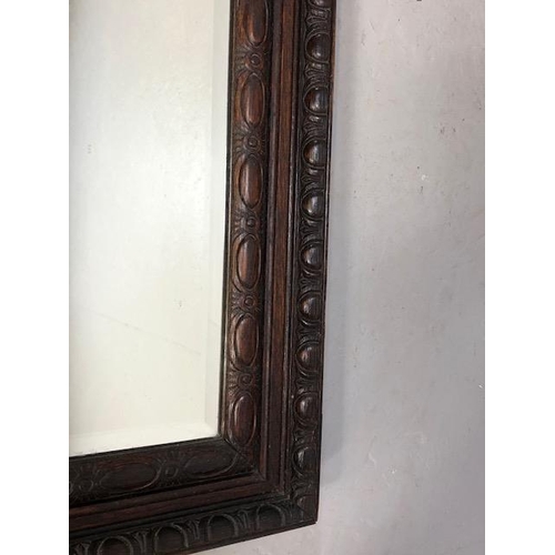 372 - Large wooden carved framed bevel edge mirror approx 78 x 125cm