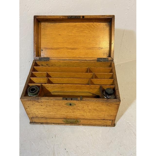 403 - Antique oak slope top writing box with stationary and ink compartments internal bar lock for draw ap... 