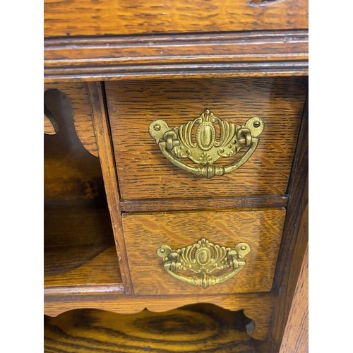 413 - Antique Smokers cabinet, in light oak, part glazed doors opening to show drawers and pipe rack  appr... 