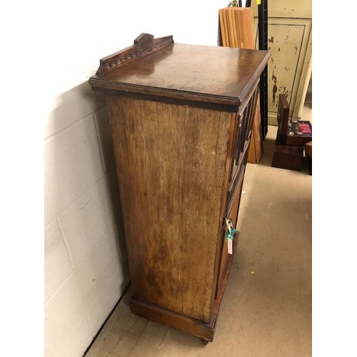 414 - Oak cupboard with bevelled glass inserts and carved panel, opening to three shelves, with original k... 