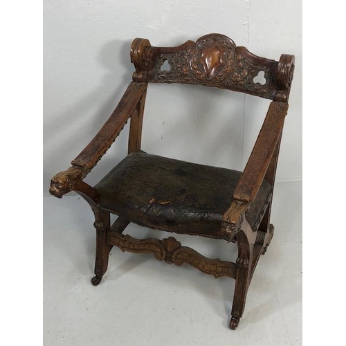 421 - Antique Furniture, 19th Century Spanish revival arm chair the frame with carved decoration of lions ... 