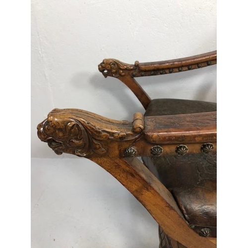 421 - Antique Furniture, 19th Century Spanish revival arm chair the frame with carved decoration of lions ... 