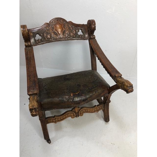 421 - Antique Furniture, 19th Century Spanish revival arm chair the frame with carved decoration of lions ... 