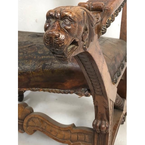 421 - Antique Furniture, 19th Century Spanish revival arm chair the frame with carved decoration of lions ... 