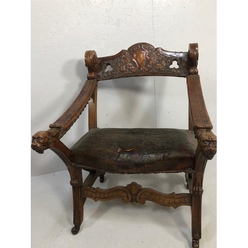 421 - Antique Furniture, 19th Century Spanish revival arm chair the frame with carved decoration of lions ... 