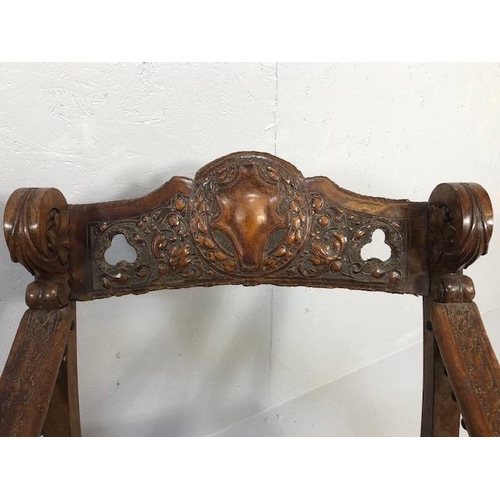 421 - Antique Furniture, 19th Century Spanish revival arm chair the frame with carved decoration of lions ... 