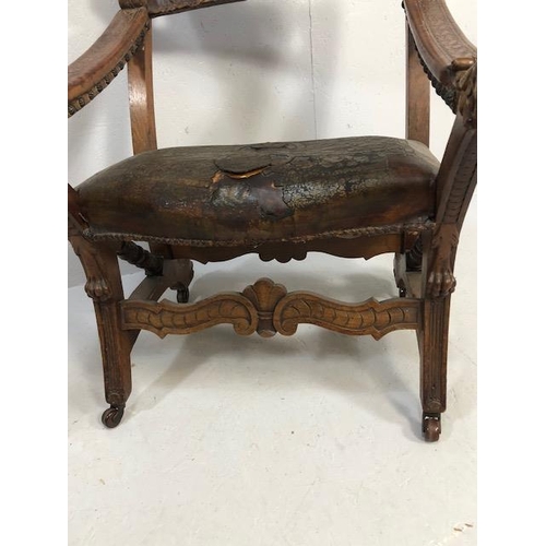 421 - Antique Furniture, 19th Century Spanish revival arm chair the frame with carved decoration of lions ... 